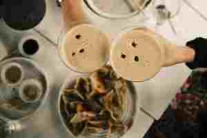 People toasting with Espresso Martinis at a Boston Bar