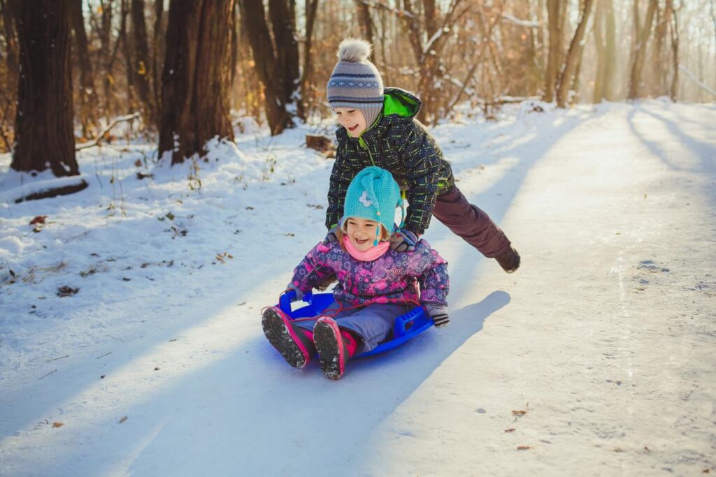 kids sledding in Boston