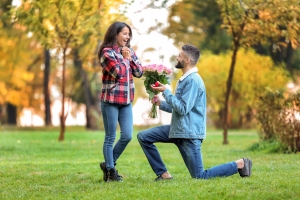 Young Man Proposing to His Beloved in Christopher Columbus Park Trellis